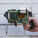Illustration for article titled Guy invents an 8-Bit instant camera gun that prints images on receipts